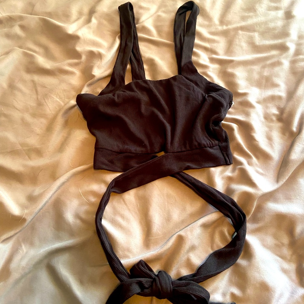 Crop top with cross body straps. Ribbed detailing. Never worn.